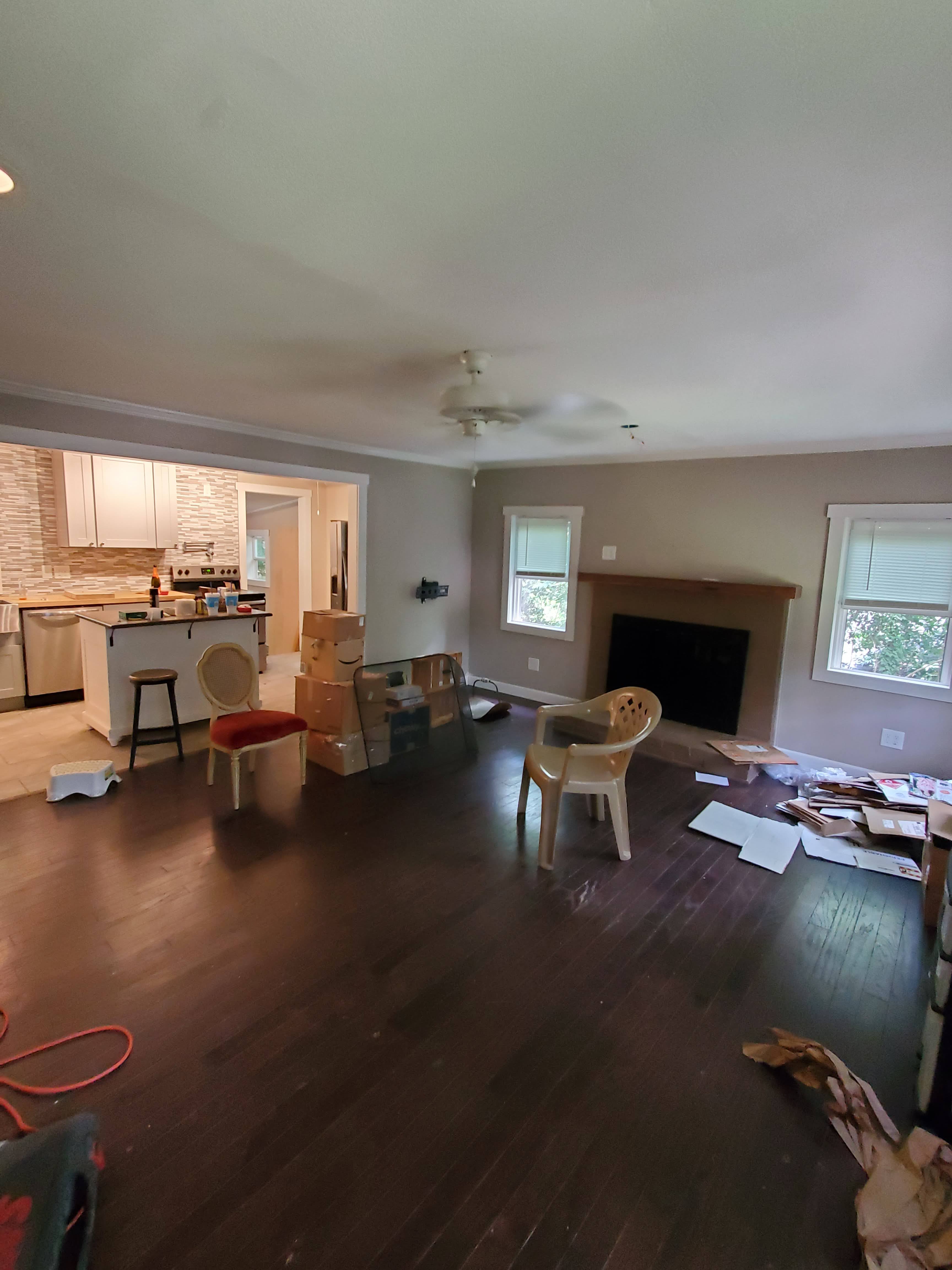Living room and kitchen area with moving boxes