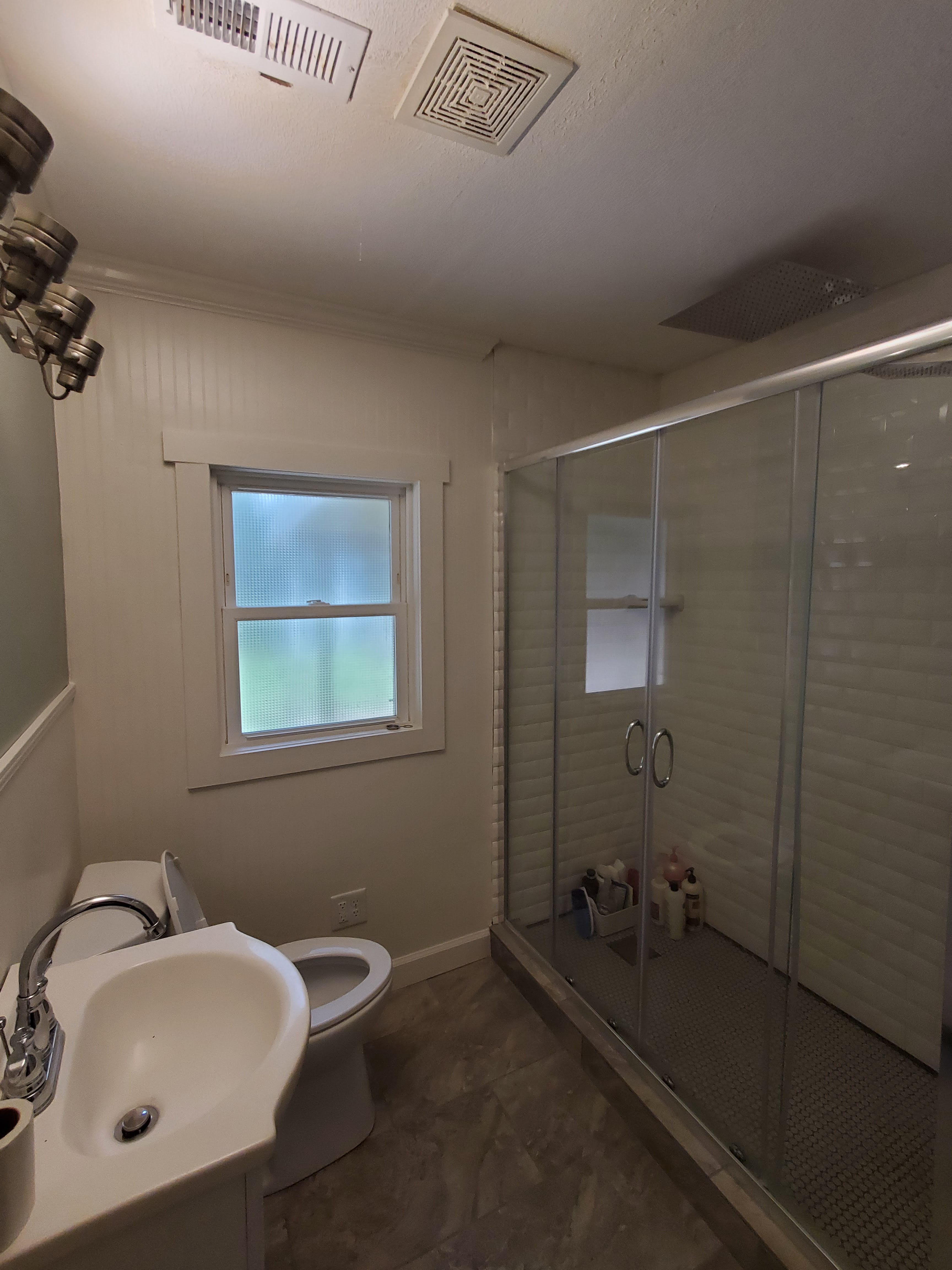 Bathroom with modern shower and fixtures