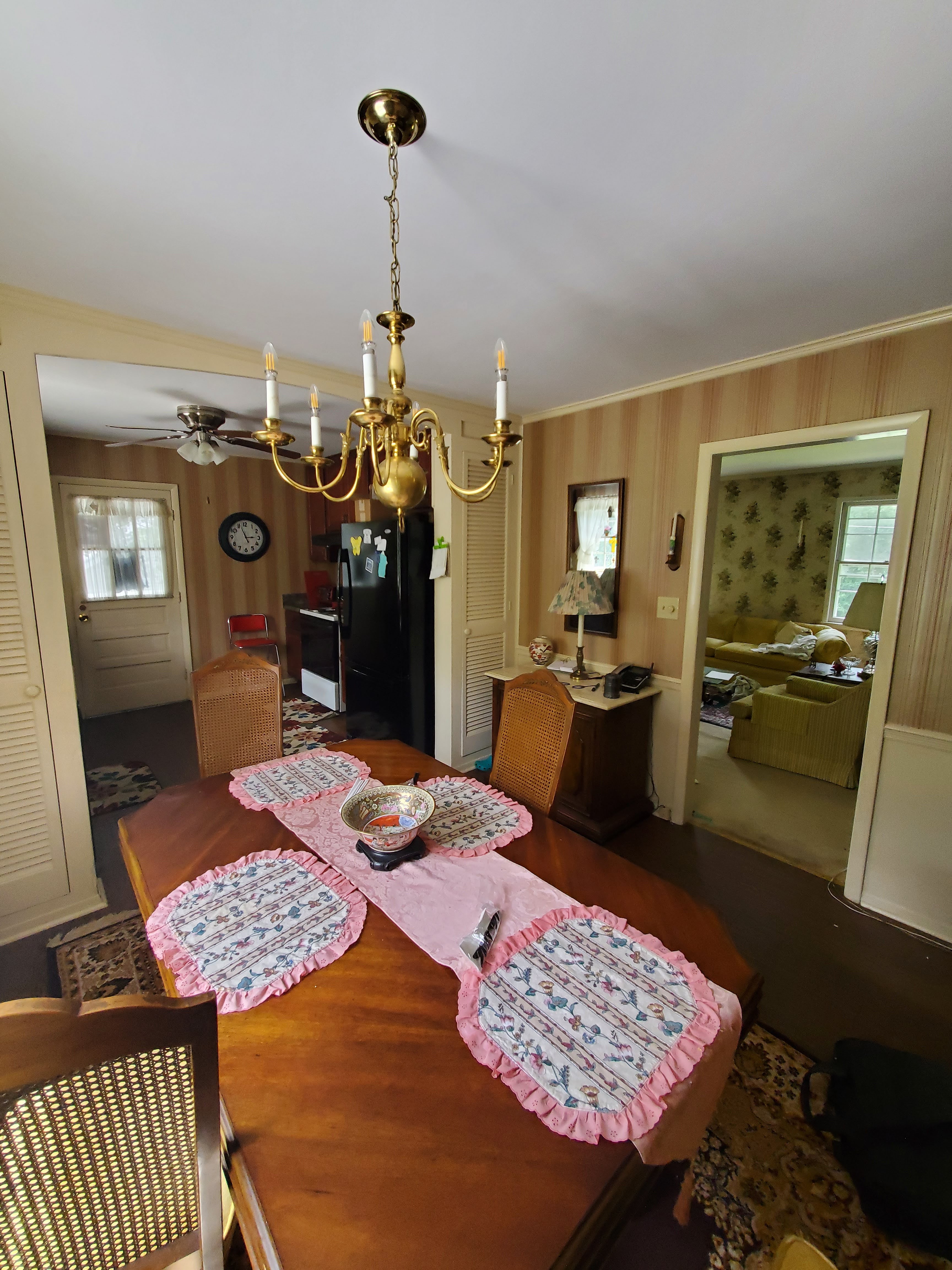 Dining room with wooden table and chandelier
