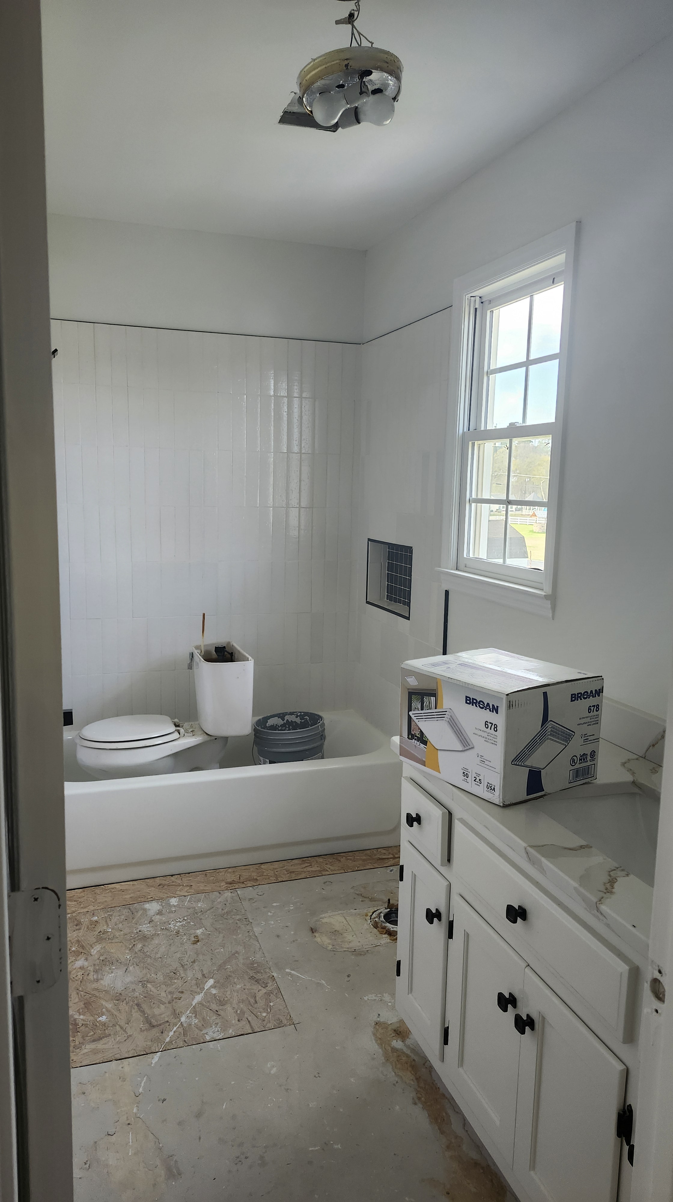 Living room with hardwood floors and natural light